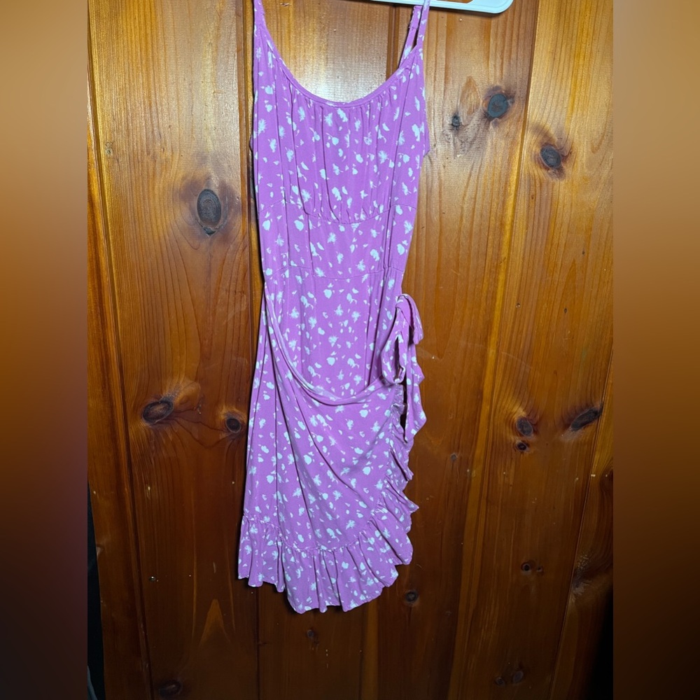 This pink flower dress has only been worn once! It raps and ties on the side